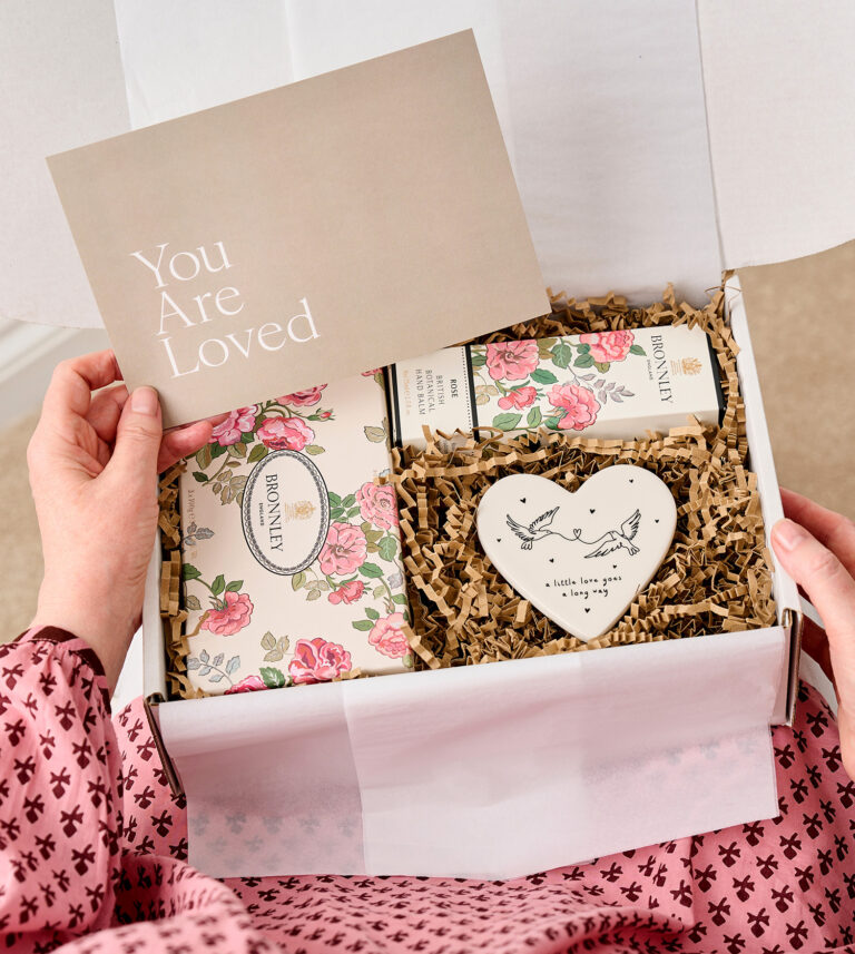 Rose gift box on knee 768x857